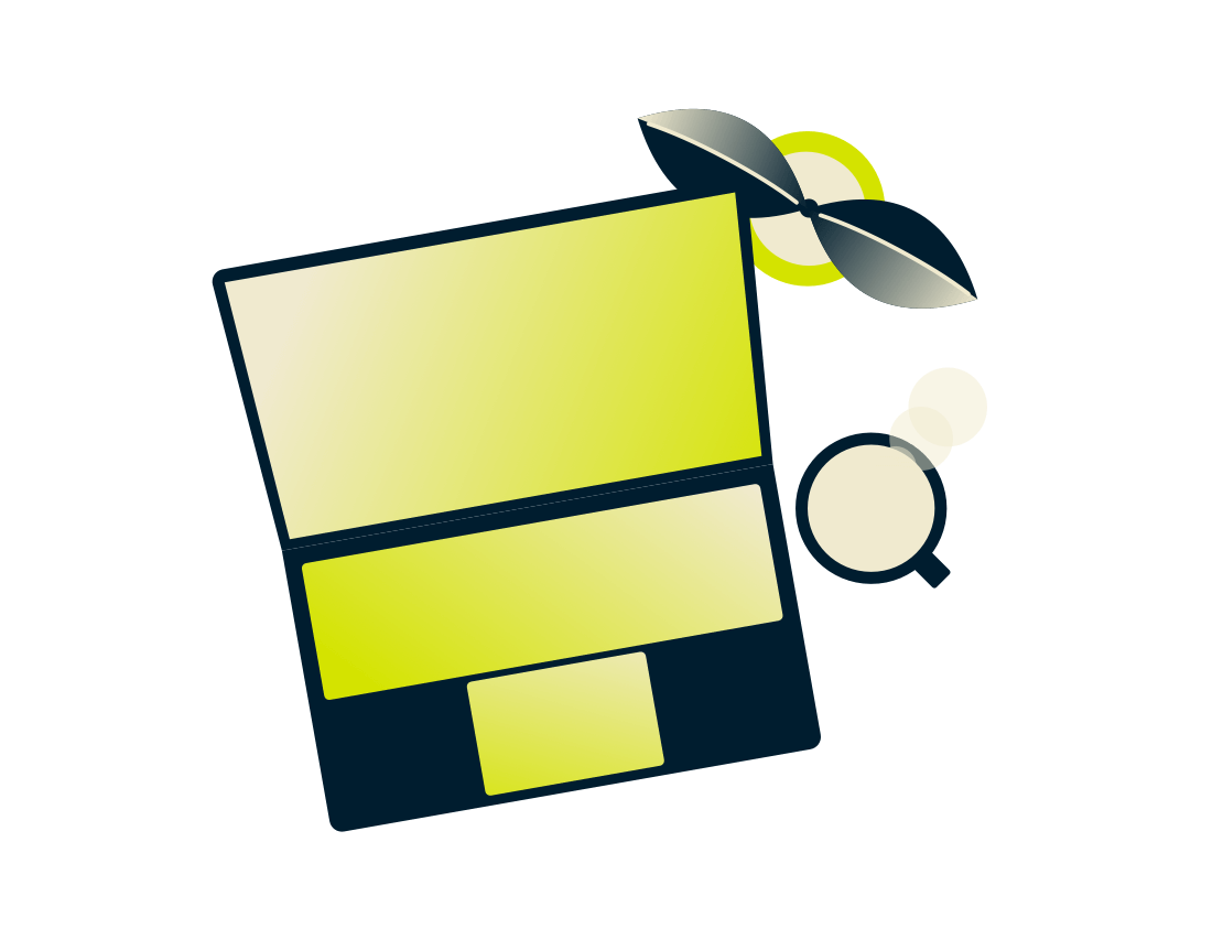 Laptop s rostlinou a pitím.