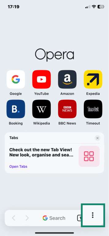 Opera app open on iOS with three-dot menu highlighted